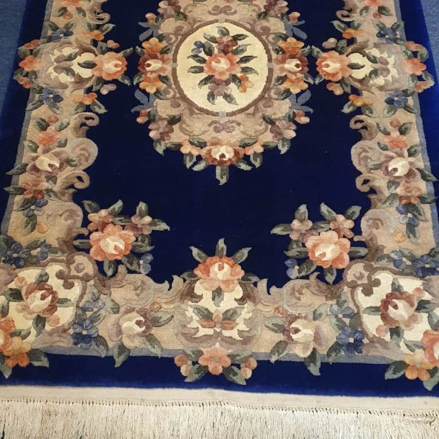 The same rug with its deep blue colour restored after rug cleaning