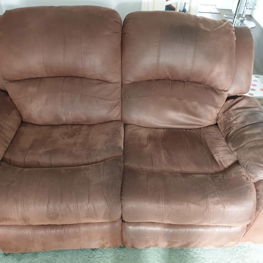 Brown suede sofa with grubby, worn cushions before upholstery cleaning